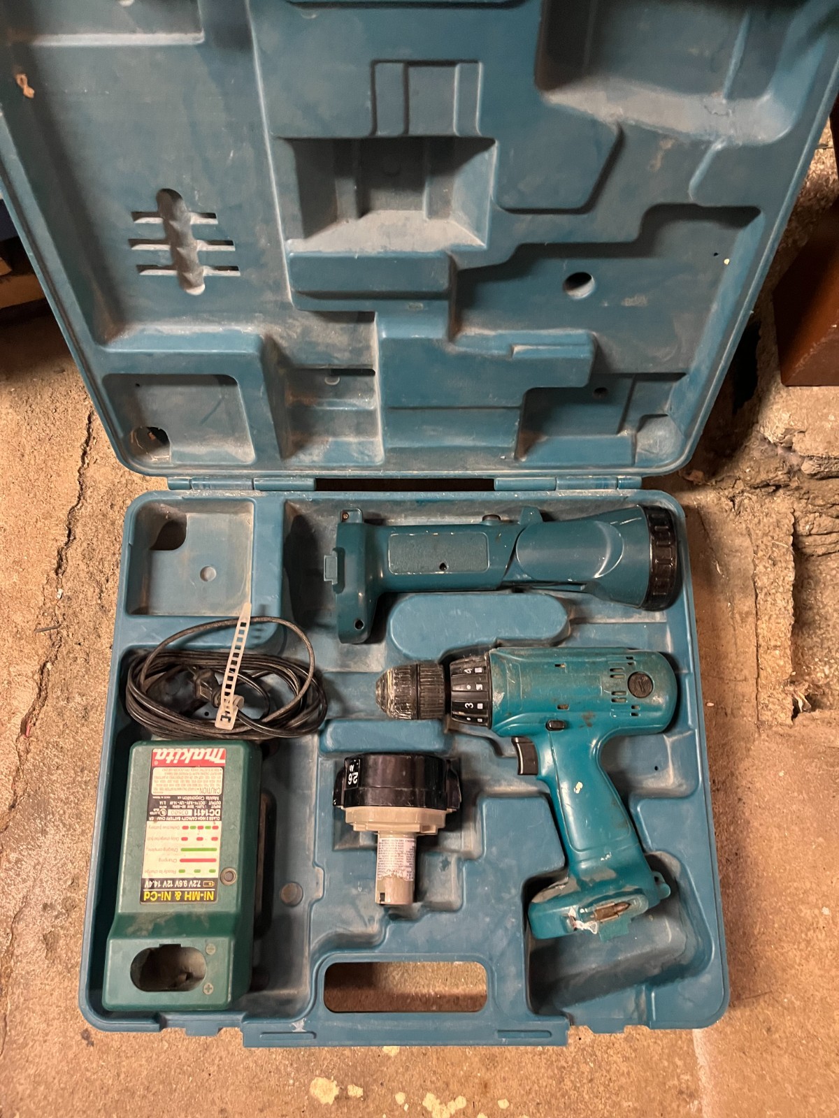 Makita 14.4 Volt Cordless Drill, Flashlight, and Charger (battery no good)