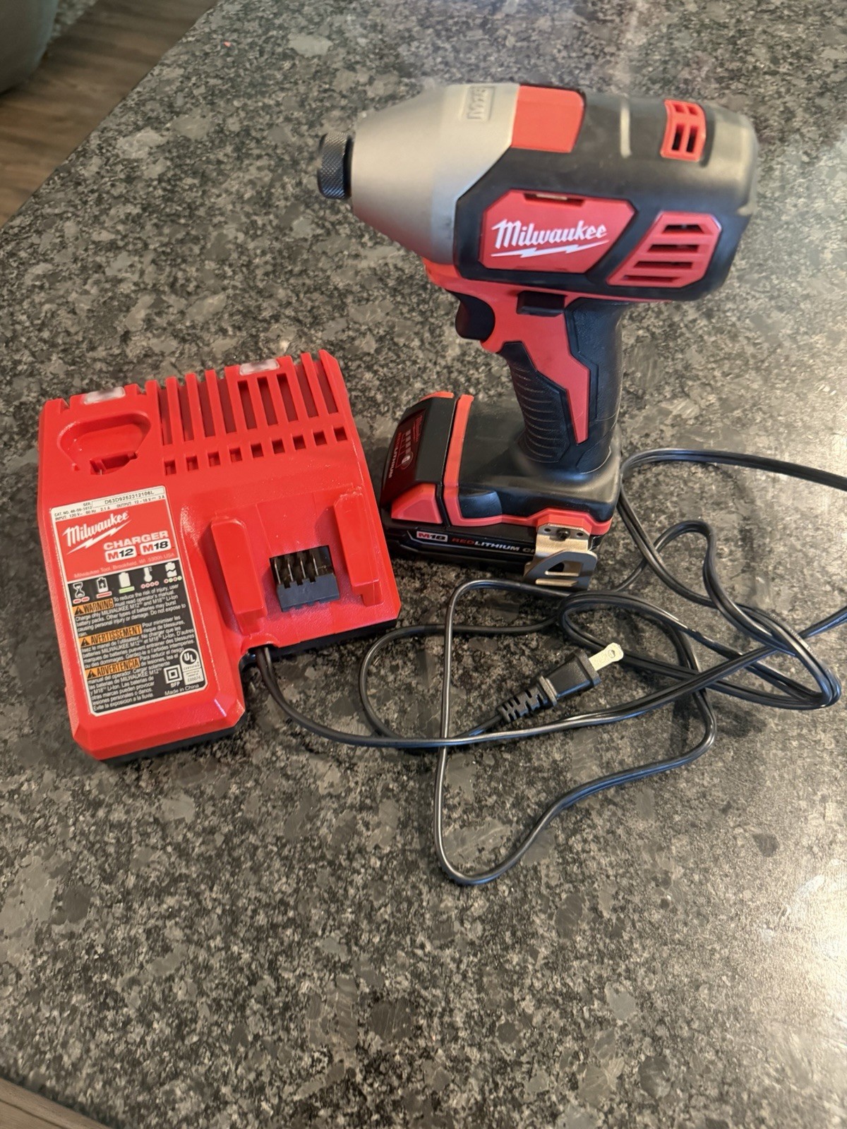 Milwaukee M18 Impact Driver with Red Lithium CP 1.5 battery and M12/M18 Charger