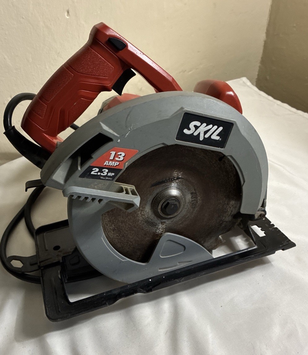 SKIL 13 Amp Corded Electric Circular Saw 2.3 HP Handheld Power Tool Red Silver
