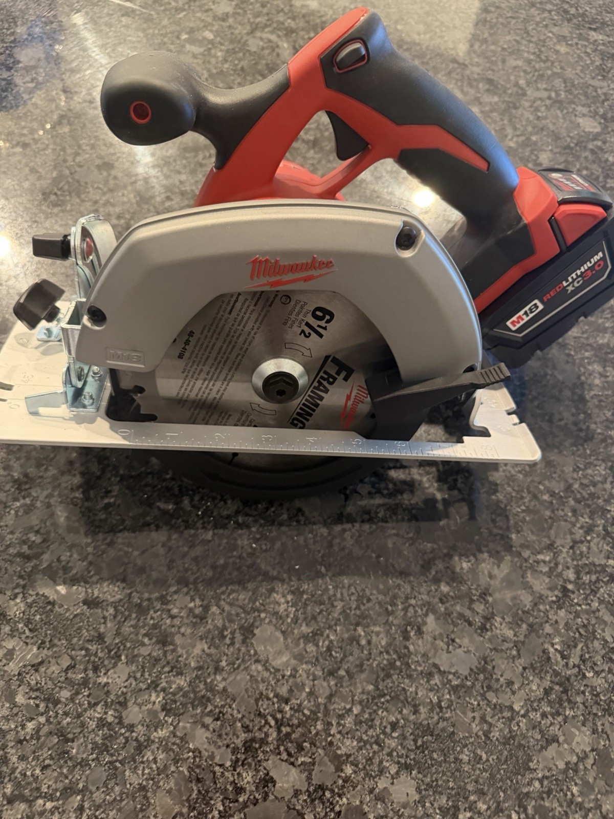 Milwaukee M18 6.5-inch cordless circular saw with M18 XC 3.0 battery.