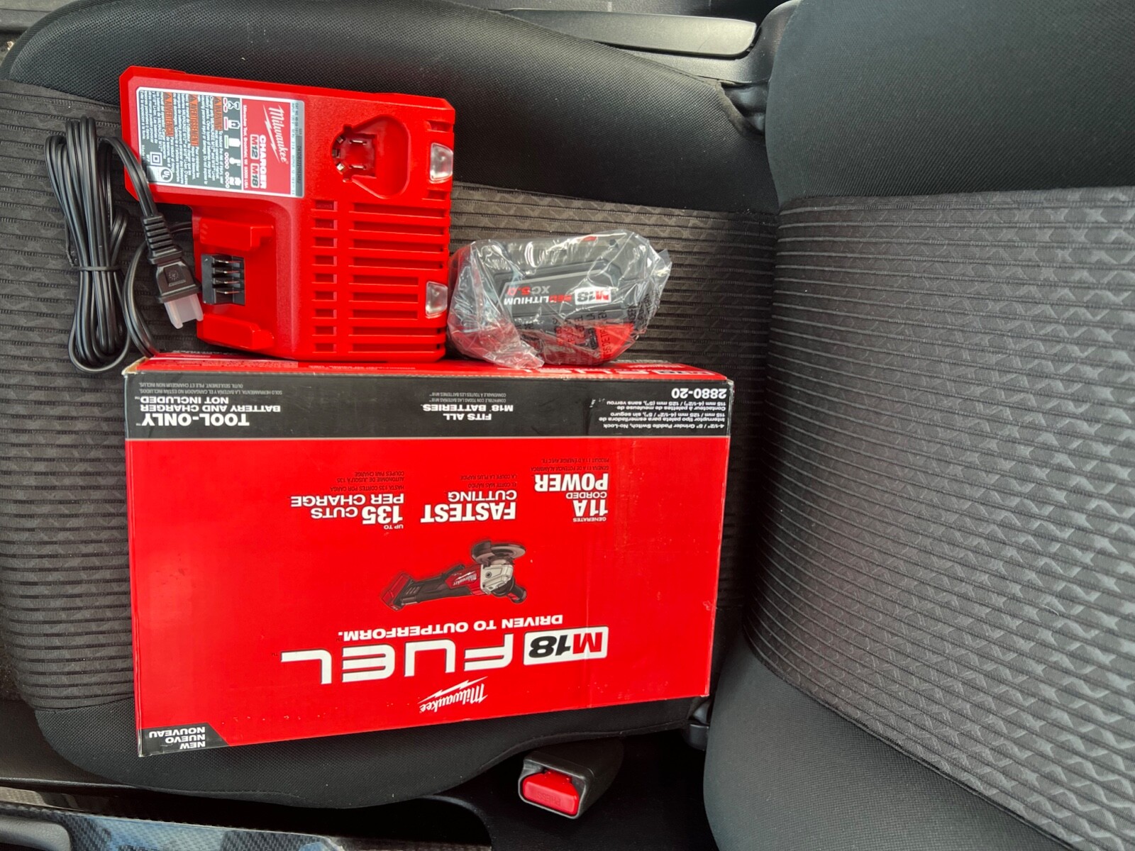 milwaukee 4.5 grinder with 5.0 amps battery and a charger