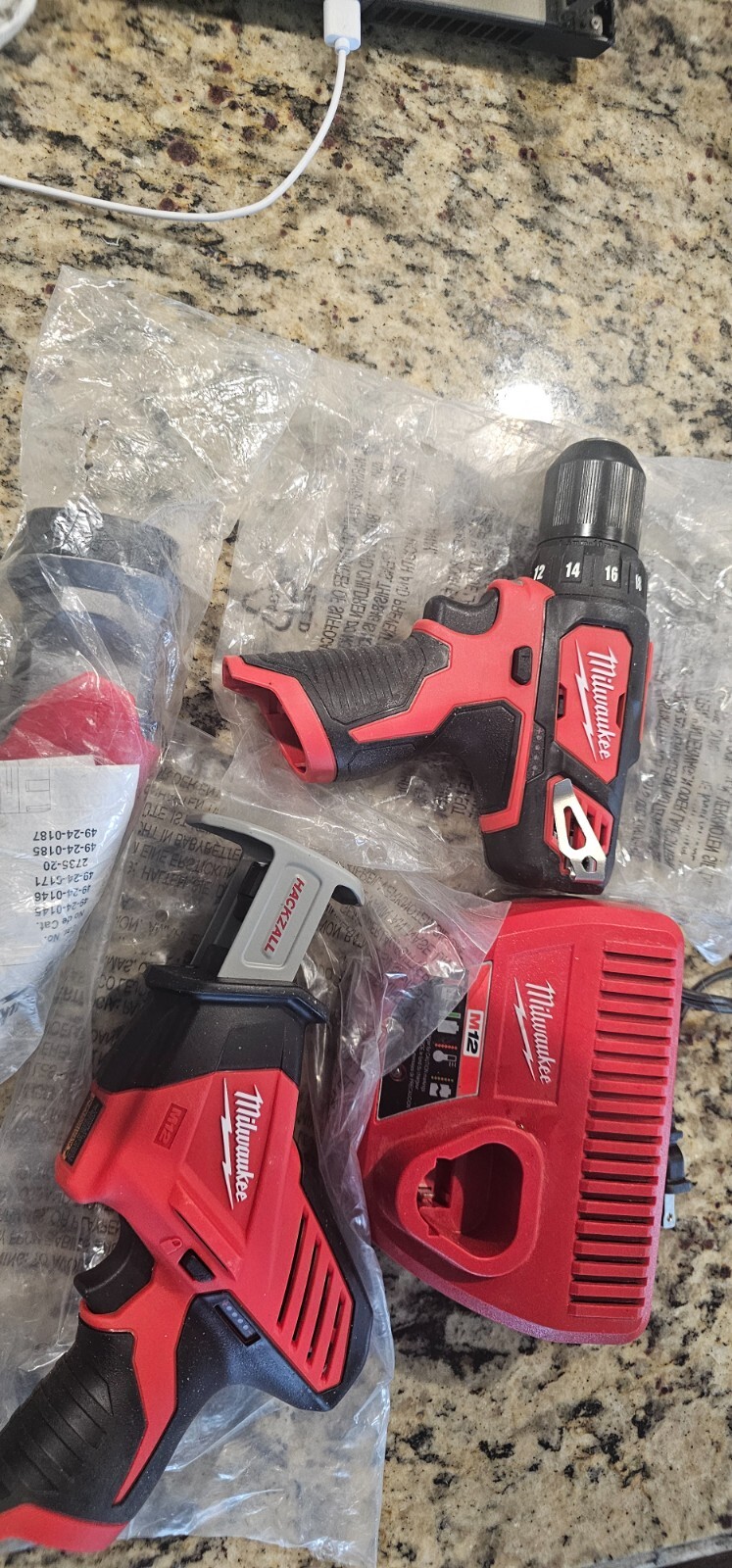drill, hackzall,flashlight and charger no batteries