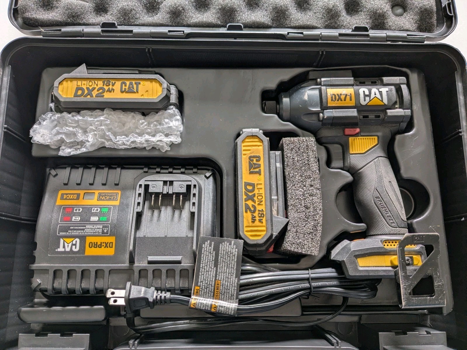 CAT DX71 18V 1/4in Impact Driver, 2x 2.4Ah Batteries, Charger, Bit Magnet Holder