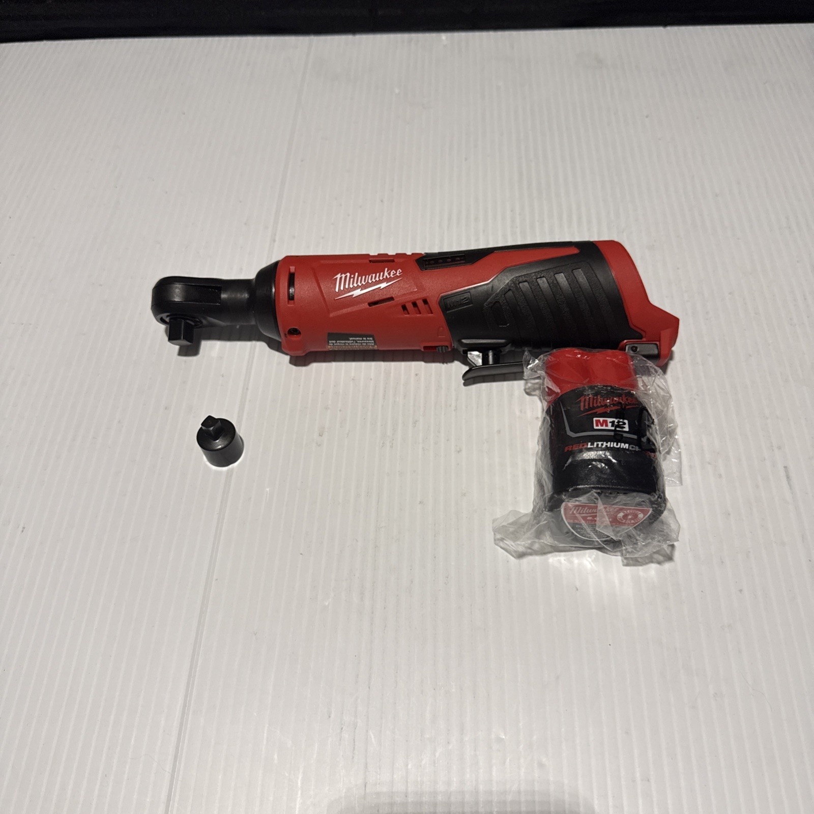 Milwaukee 2457-20 M12 3/8 Ratchet with CP1.5 Battery and 1/4 Inch Adapter
